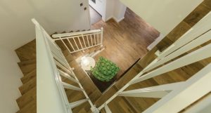  In this Springs Townhouse, Oak Stone flooring extends seamlessly across stairs and upper levels.