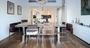 The dining space features Oak Tramonto flooring, balancing darker timber tones with lighter finishes.