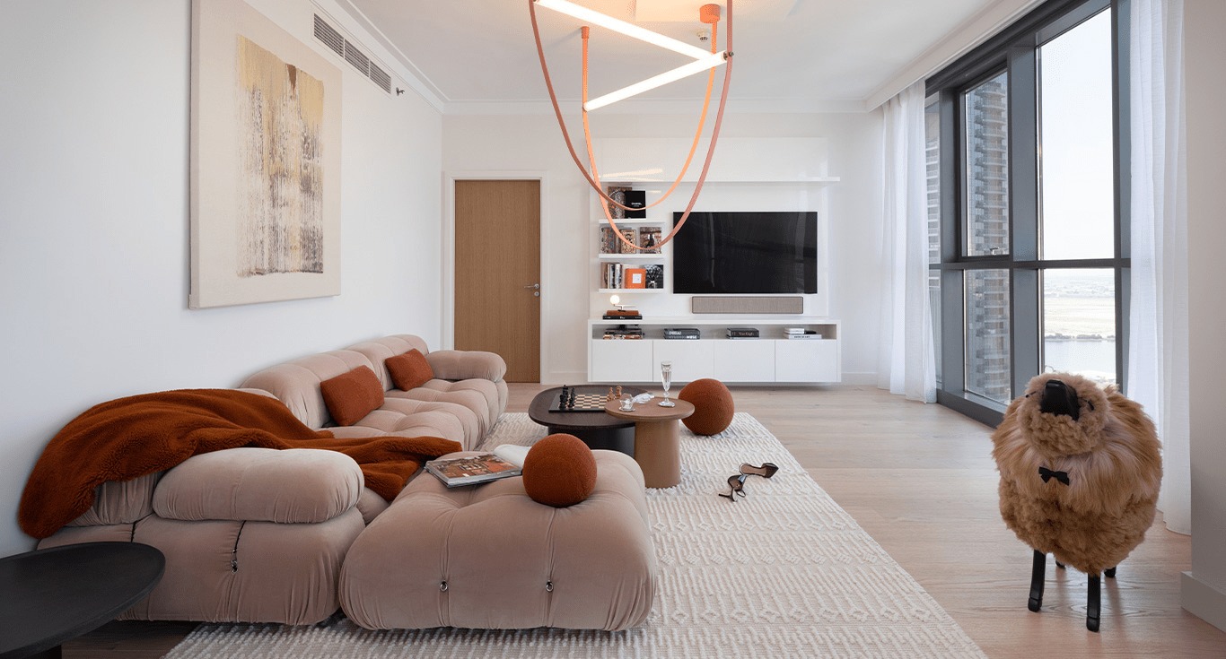 Oak wood flooring and tailor-made furniture giving warmth to this Dubai Creek Harbour apartment