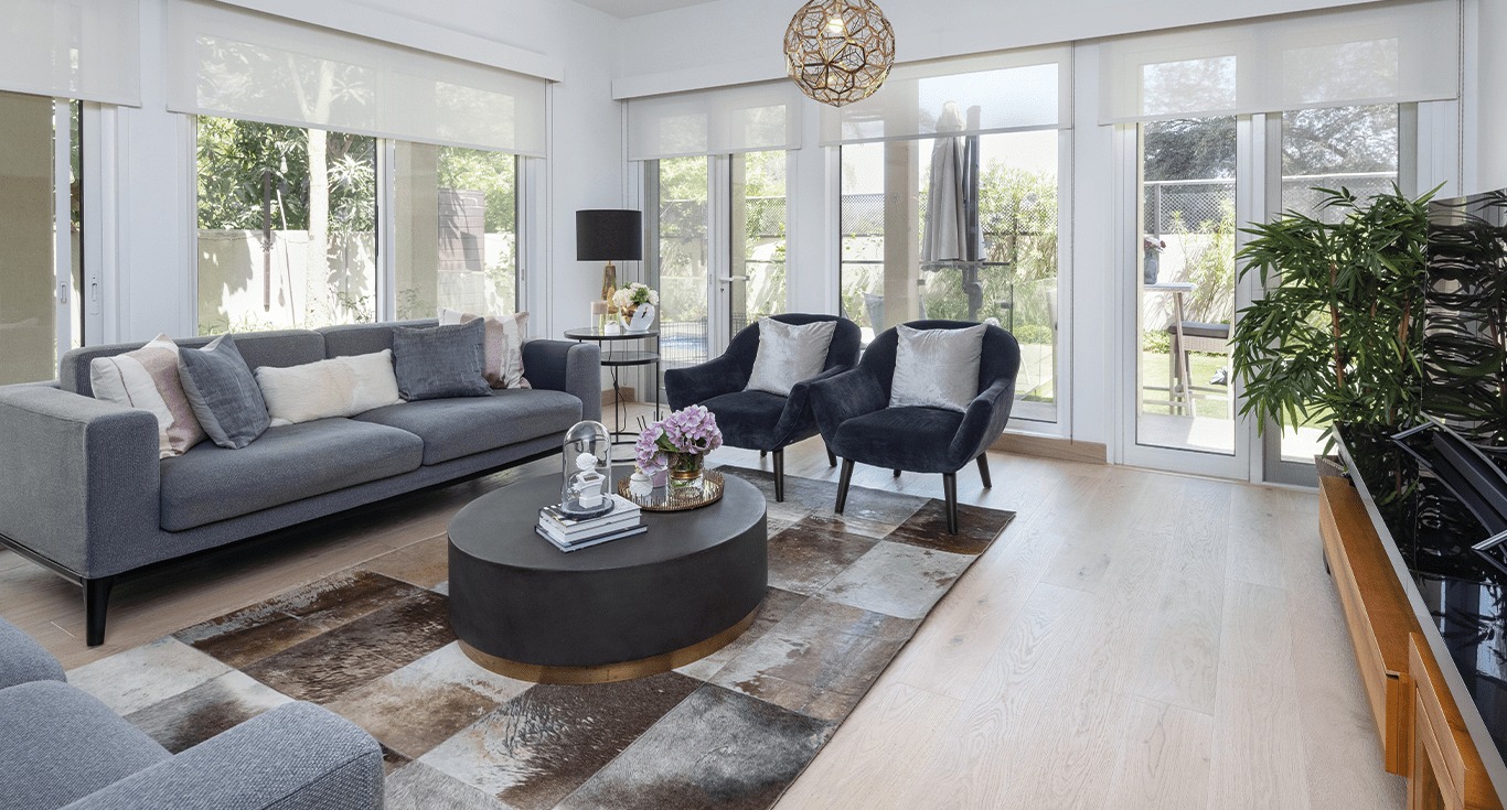 Modern furnishings on light oak flooring create a cozy vibe to this family home in Saheel 2