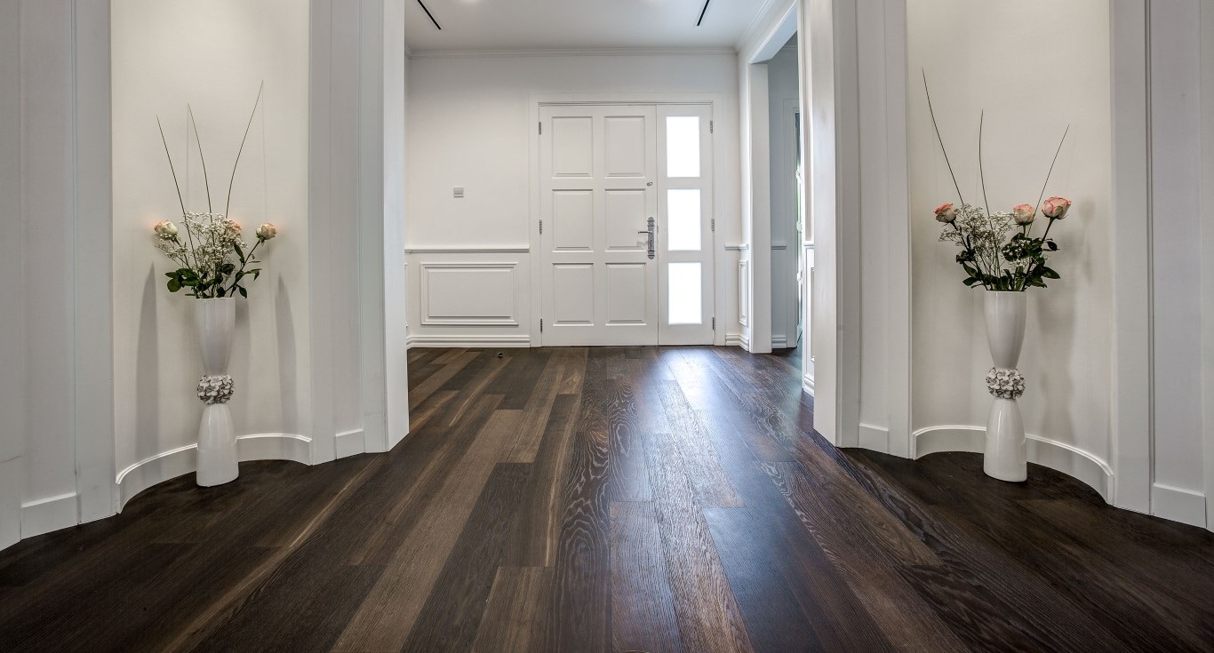 A Private Villa in Green Community West, Dubai, showcasing Nordic Homeworx's stunning dark brown flooring paired with elegant white walls for a timeless look.
