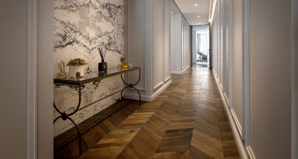 Oak Chevron Dark Brown at a private Al Khawaneej villa, where rich smoked tones and a classic chevron pattern define the character of the space.