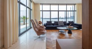 A contemporary waterfront villa in Al Hamra, Ras Al Khaimah, where Kährs Oak Chevron Light Brown brings natural warmth to an open, light-filled space.
