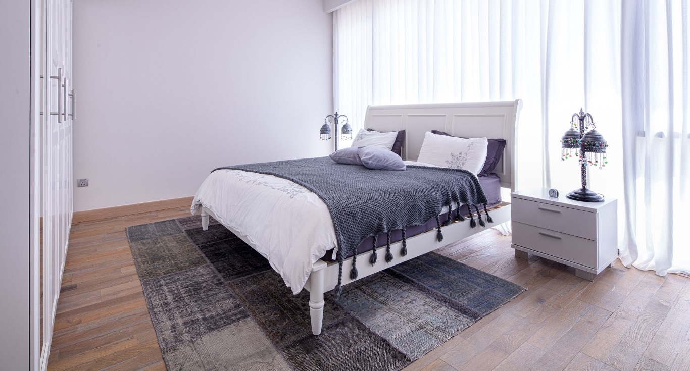 Sidra Villa in Dubai Hills Estate, with classic lavender walls and elegant dark brown wood flooring by Nordic Homeworx