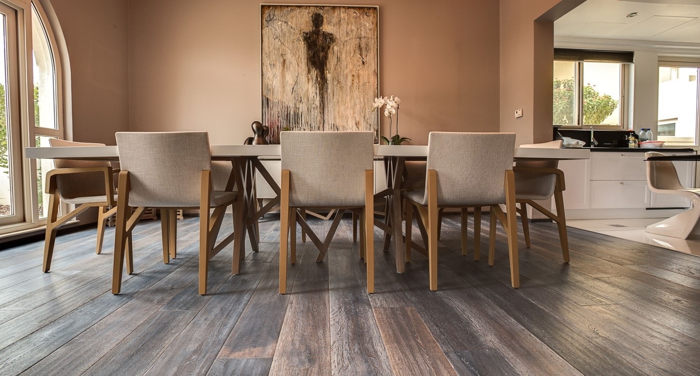 Villa in Esmeralda, Victory Heights, Dubai, complementing the elegant tan walls with a cosy dark wood flooring by Nordic Homeworx