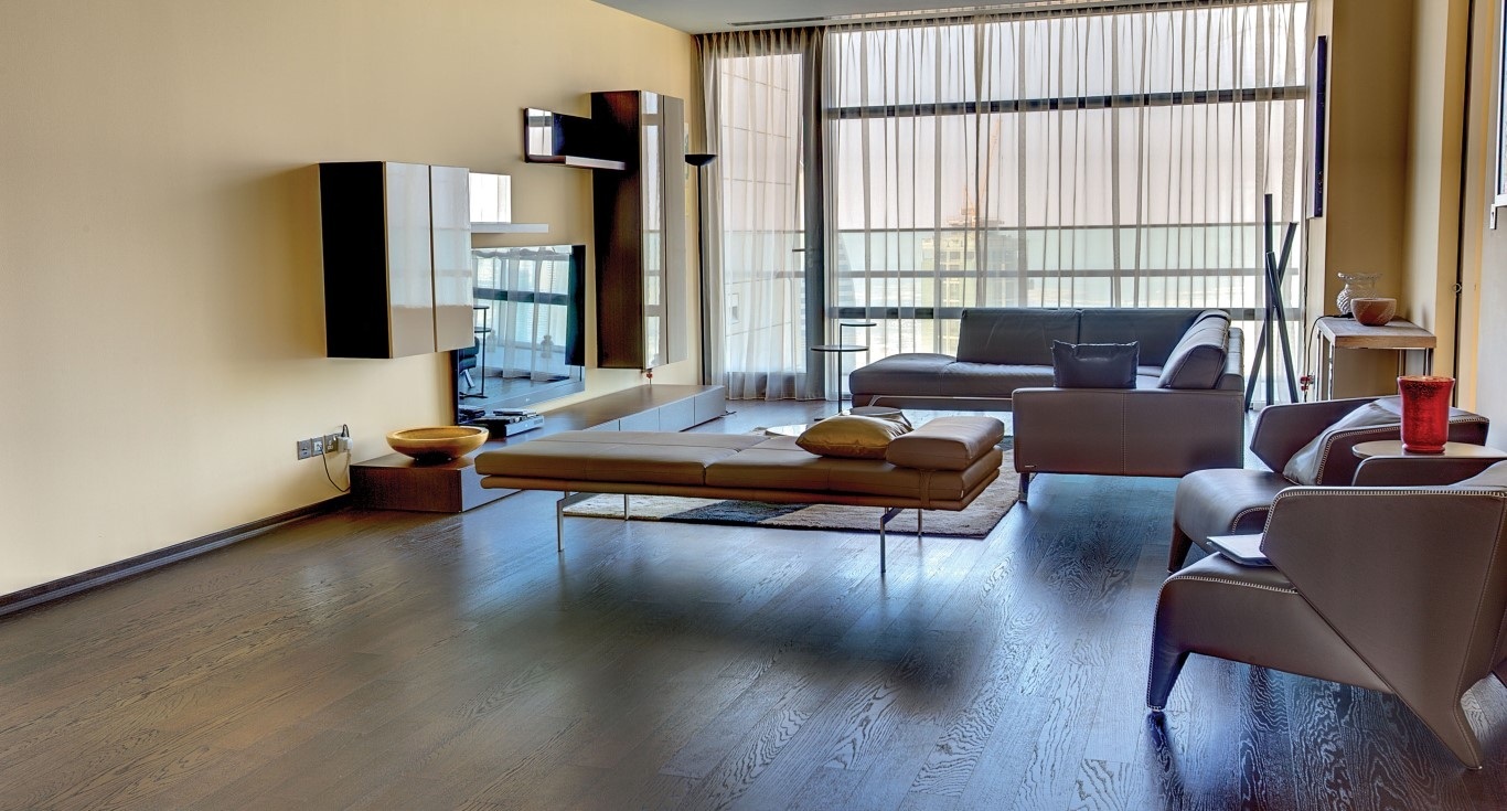 Index Tower Apartment in DIFC, Dubai, showcasing the elegant yellow walls with a welcoming dark brown flooring by Nordic Homeworx