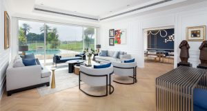 Hattan Villa living room is fitted with Oak Herringbone AB Crème White floors in a clean herringbone layout.