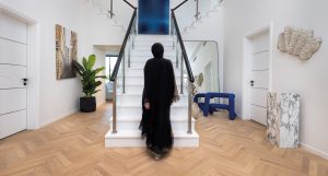 Sanctuary Falls Villa in Jumeirah Golf Estates, anchors Kährs Studio Oak AB White herringbone floors in the entrance and hallways.