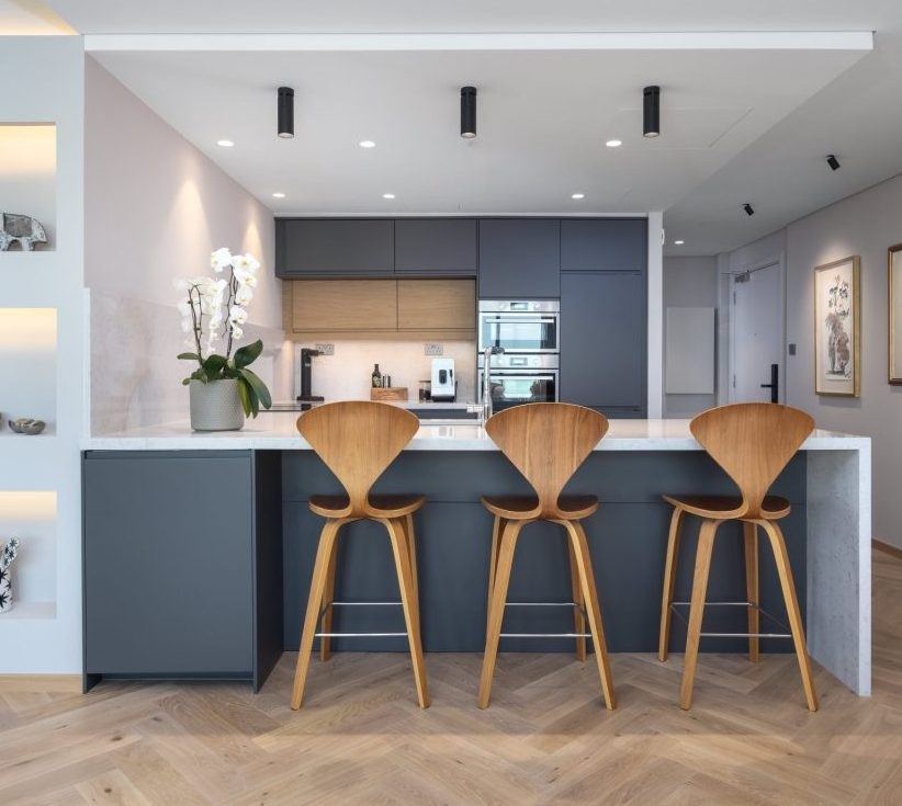 A traditional herringbone pattern inside this Scandinavian-inspired apartment in Fairways North Apartment, by Nordic Homeworx