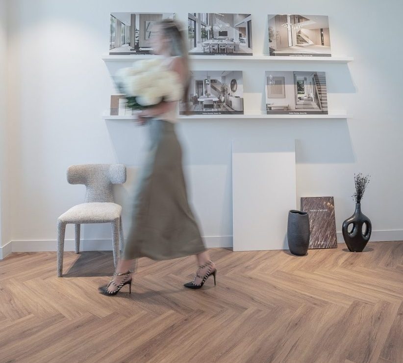 Interior of Elementa Design Studio showcasing a skinny extra-long herringbone pattern flooring, by Nordic Homeworx