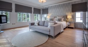Flame Tree Ridge Villa Jumeirah Golf Estates Oak Dew flooring paired with a soft carpet for a defined bedroom setting