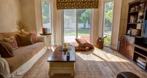 Green Community Bungalow Dubai Investments Park Oak Siena flooring with a textured carpet defining the seating area
