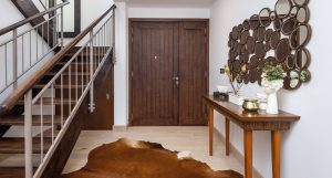 Saheel Villa Arabian Ranches Oak Estoril flooring paired with a textured carpet shaping the entry space