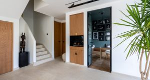 Studio Oak AB herringbone flooring in a Maeen villa, showcasing an eco-friendly wood choice with natural texture.