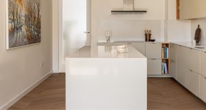 Ghadeer Villa in The Lakes, Dubai, showcases a modern kitchen with high-quality LVT eco flooring from Nordic Homeworx.