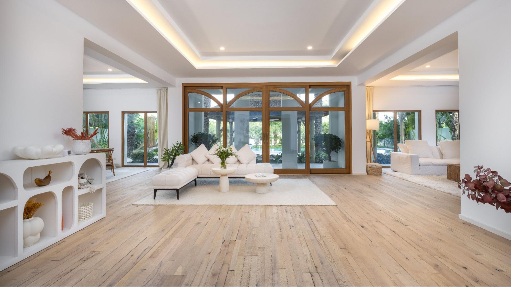 Scandinavian-inspired interior detail with natural wood flooring, soft textiles, and greenery reflecting Nordic Homeworx Living philosophy.