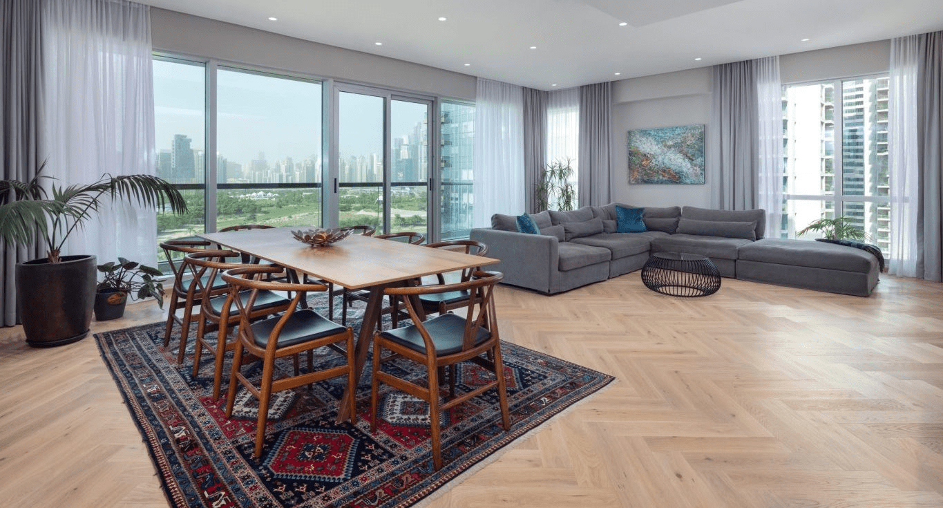 A client’s living room, featuring Herringbone Oak parquet flooring by Nordic Homeworx Dubai, complements the Scandinavian interior