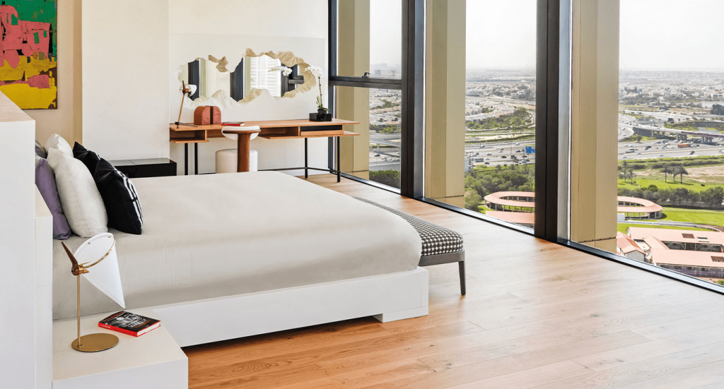 A bedroom with Oak flooring at Business Bay Penthouse, Dubai. Discover the best way to clean hardwood floors by Nordic Homeworx.
