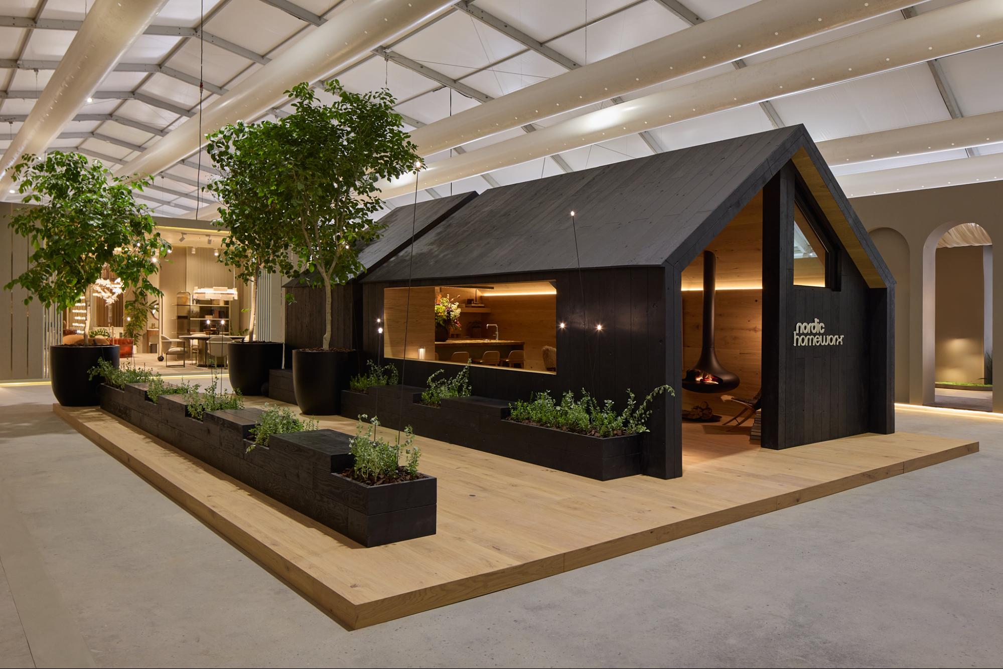 Exterior view of the Nordic Cabin at Downtown Design by Nordic Homeworx showing natural wood textures and modular structure.