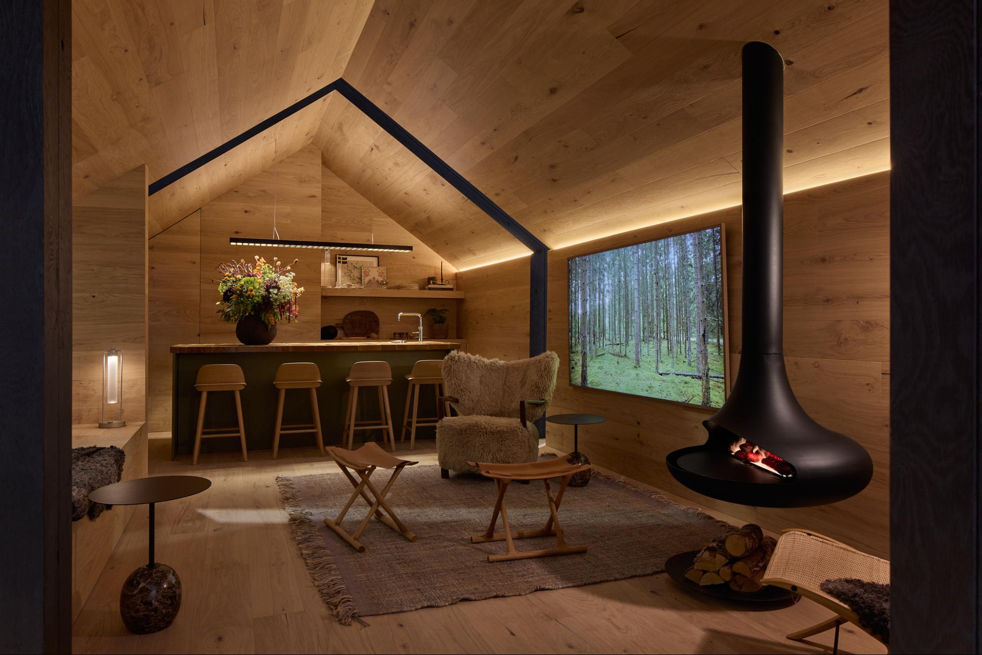 Interior view of the Nordic Cabin at Downtown Design by Nordic Homeworx showcasing warm Urban Brown wood flooring and textures.