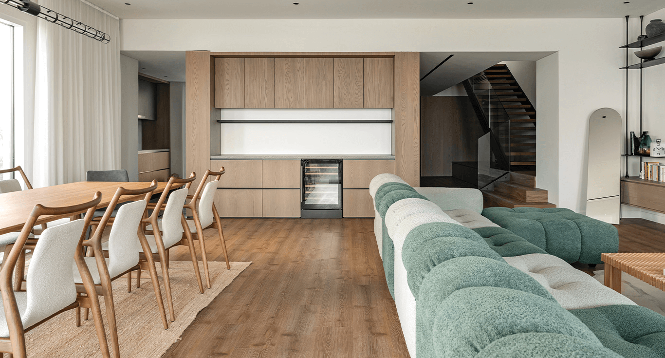 Warm and luxurious three-story house in Dubai, featuring rich brown and amber-toned wood colour floors from Nordic Homeworx.