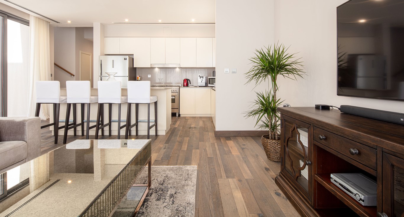 Wood flooring types that give a warm look to a villa in Dubai, transforming the modern space into a cosy family home.