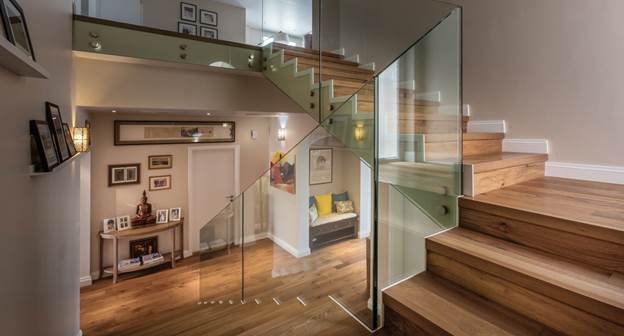 Teak wood colour in a townhouse in Dubai, bringing elegance and    continuity from living spaces to the staircase.