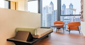 Brushed Oak Biscotti flooring with an ultra-matt finish softening light throughout this Business Bay penthouse. 