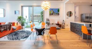 In this Dream Palm Residence home, white-washed oak flooring balances cleaner contemporary finishes with natural wood knot texture.
