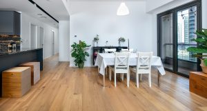 Character-grade Oak Ydre flooring introduces subtle wood knot variation throughout this renovated Rimal apartment.