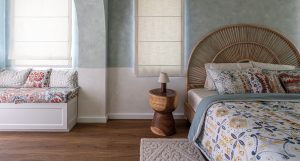 Smoked oak flooring with visible wood knot detail introduces greater depth within this layered Alvorada Villa interior. 