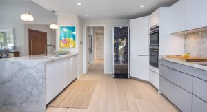 Wide oak wood plank flooring in the kitchen at Zulal Villa