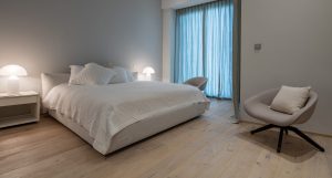 Oak Olof hardwood flooring introducing subtle grain character within this minimalist Cayan Tower apartment. 