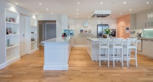 Oak hardwood flooring supporting everyday family living throughout this renovated Rimal apartment. 