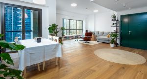 Character-grade hardwood flooring introducing natural variation throughout this renovated Rimal apartment. 