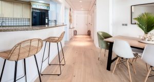 White-oiled oak flooring installed over quality underlay, enhancing everyday practicality throughout this Palm residence. 